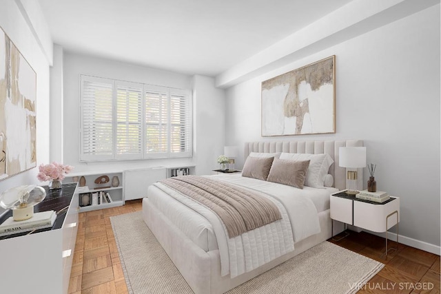 bedroom featuring parquet floors