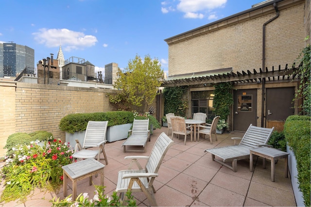 view of patio / terrace featuring outdoor dining area and a pergola