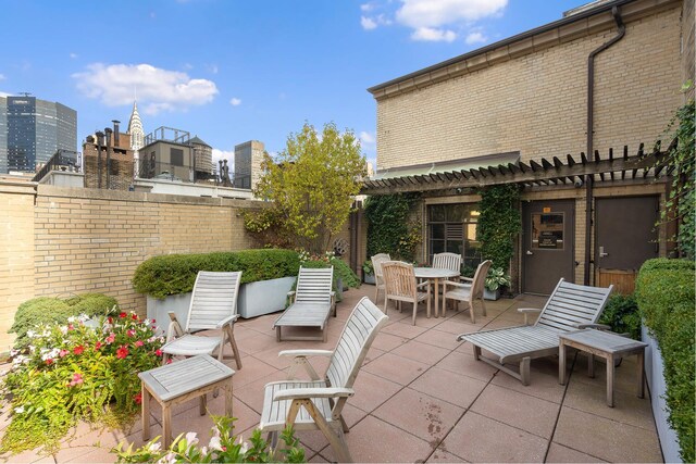 7 Park Ave Unit 23, New York City, NY 10016 - view of patio / terrace featuring a pergola and outdoor dining space
