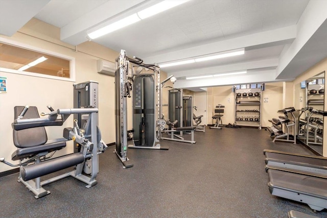 exercise room with a wall unit AC