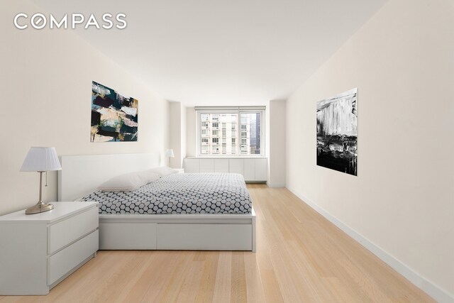 bedroom with light hardwood / wood-style flooring