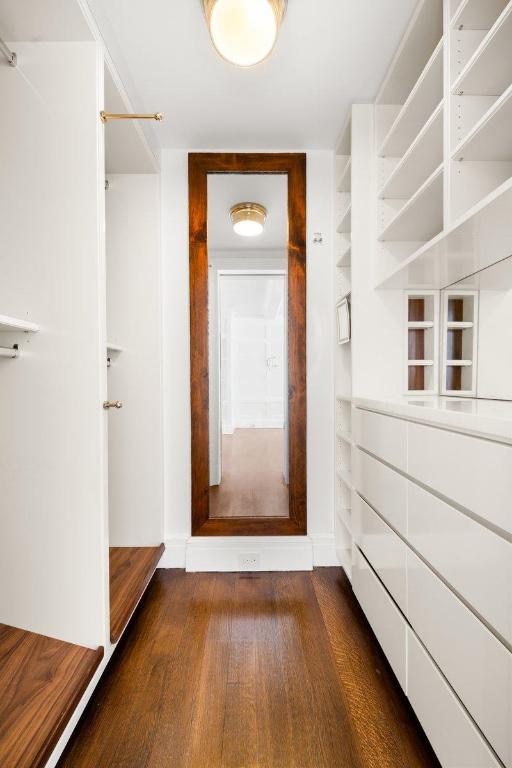 hallway with dark hardwood / wood-style floors