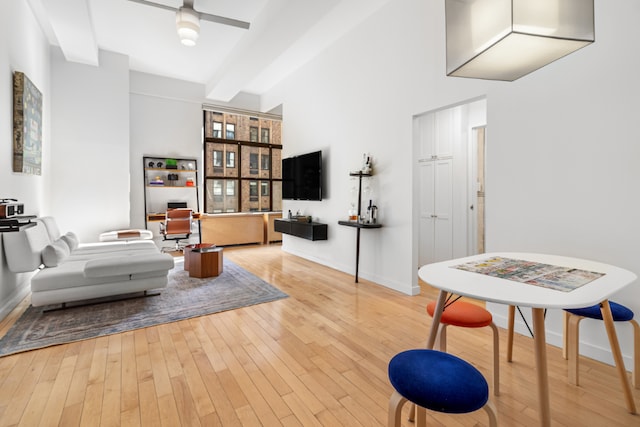 interior space with ceiling fan and light hardwood / wood-style flooring