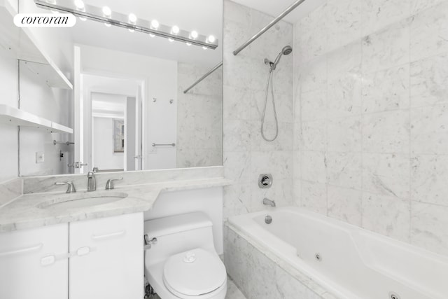 full bathroom with tiled shower / bath combo, vanity, and toilet