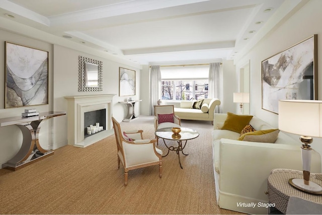 living area featuring a fireplace with raised hearth, beam ceiling, and light colored carpet