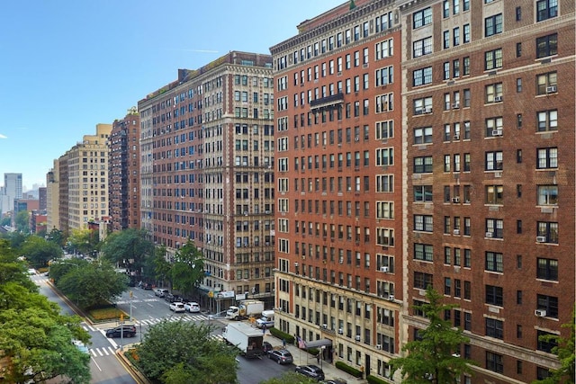 view of building exterior featuring a view of city