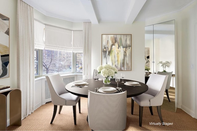 dining space with beam ceiling and light carpet