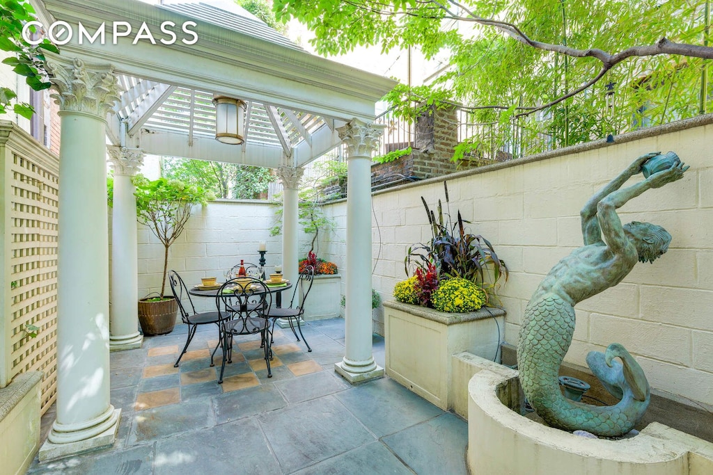 view of patio / terrace featuring outdoor dining area and fence