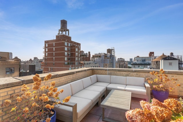 view of patio with an outdoor hangout area and a city view