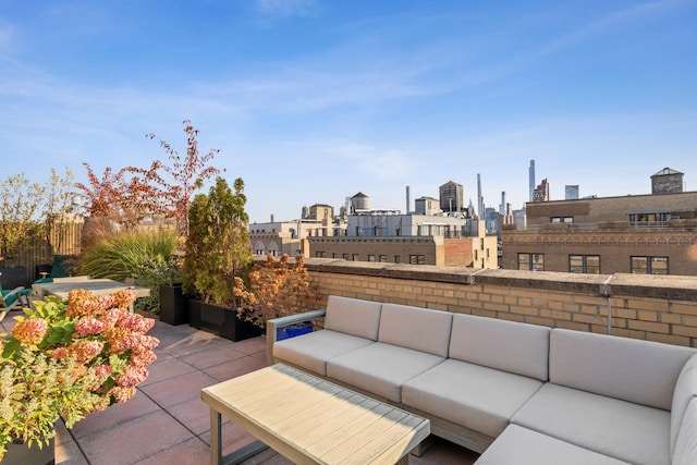 view of patio / terrace featuring a city view and an outdoor hangout area