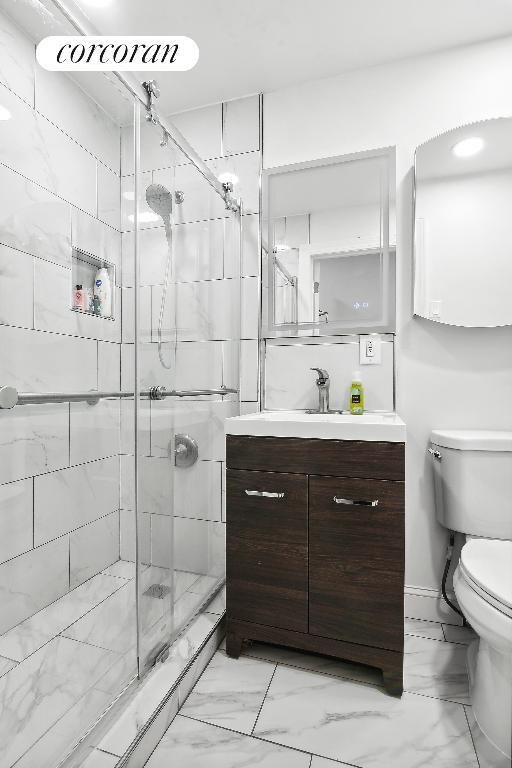 basement featuring washer / clothes dryer, light colored carpet, and a drop ceiling