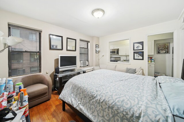 142 E 49th St Unit 3D, New York City, NY 10017 - bedroom with wood-type flooring