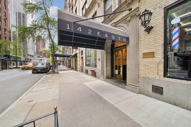 142 E 49th St Unit 3D, New York City, NY 10017 - doorway to property featuring brick siding