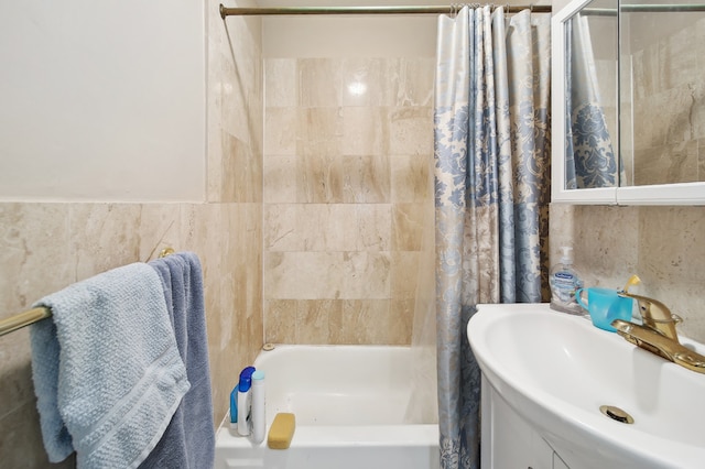 142 E 49th St Unit 3D, New York City, NY 10017 - full bath with shower / bath combo, tile walls, and vanity