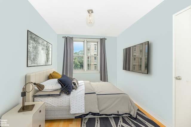 bedroom featuring light wood finished floors