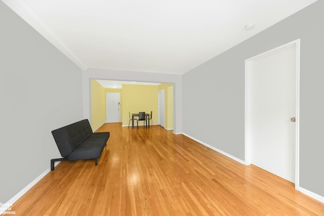 unfurnished room with light wood-style floors and baseboards