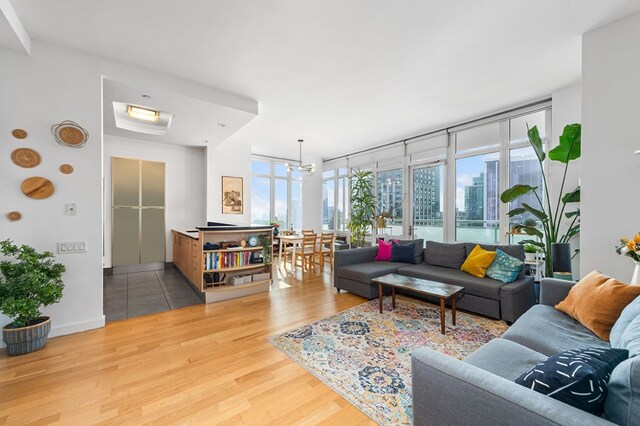 living room with floor to ceiling windows and hardwood / wood-style floors