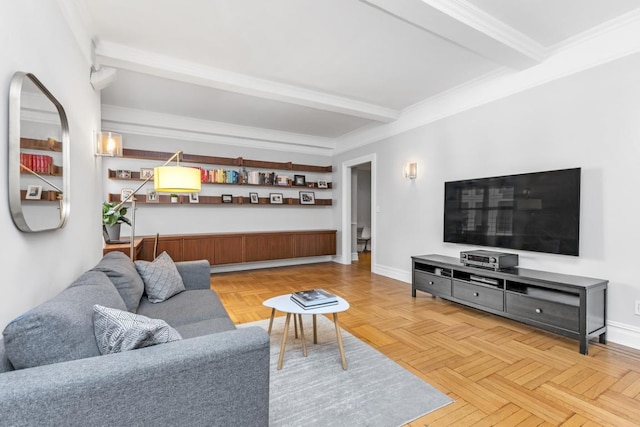 living room with beam ceiling, light parquet floors, and ornamental molding