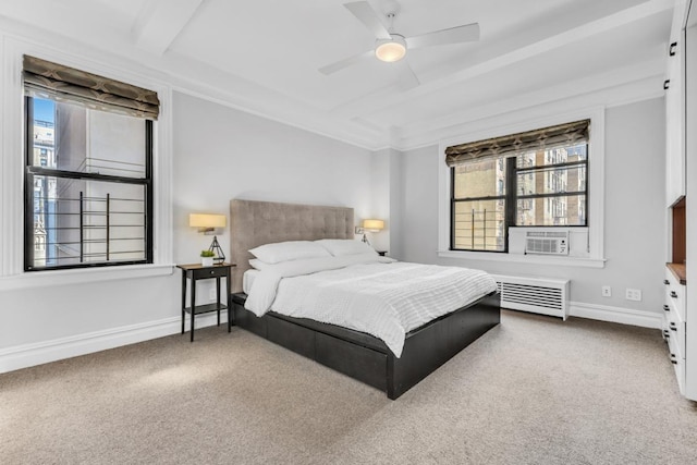 bedroom with ceiling fan, cooling unit, carpet, and radiator heating unit