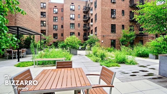 view of community with outdoor dining area