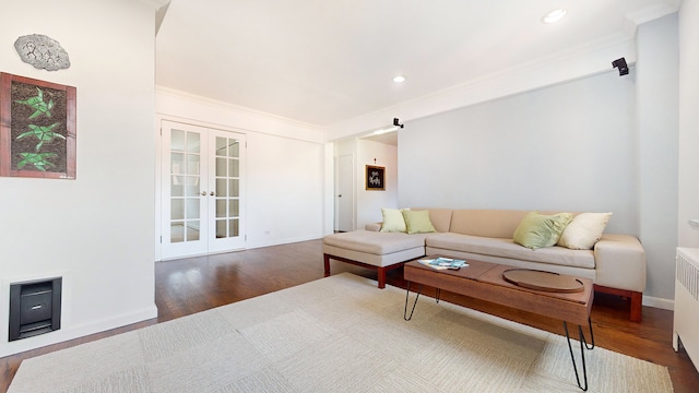 living room featuring french doors, wood finished floors, crown molding, radiator heating unit, and recessed lighting