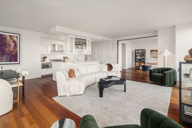 living area with dark wood-style flooring