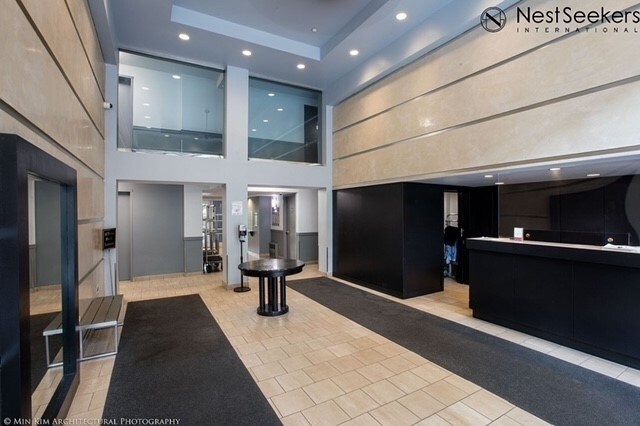 1831 Madison Ave Unit 9-F, New York City, NY 10035 - common area featuring a towering ceiling and recessed lighting