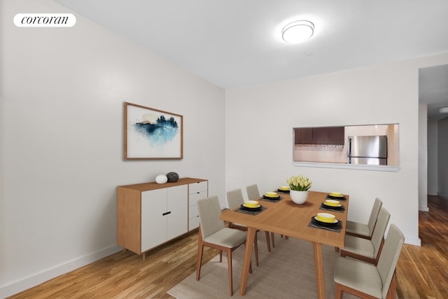 dining room featuring light hardwood / wood-style floors