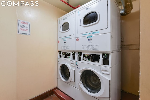 laundry area featuring stacked washer and dryer and washing machine and clothes dryer