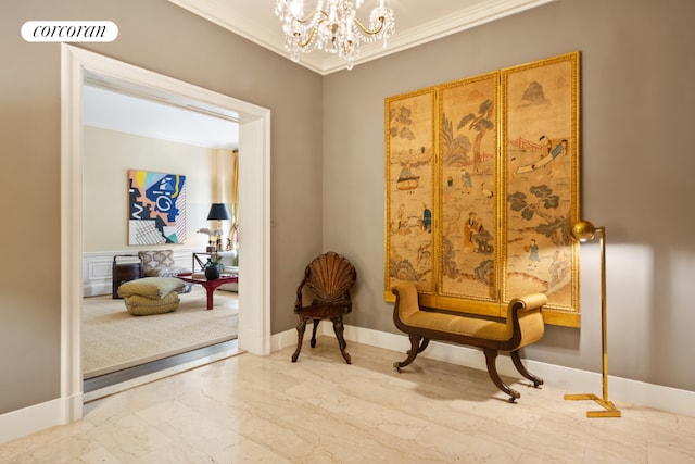 sitting room featuring crown molding and a chandelier