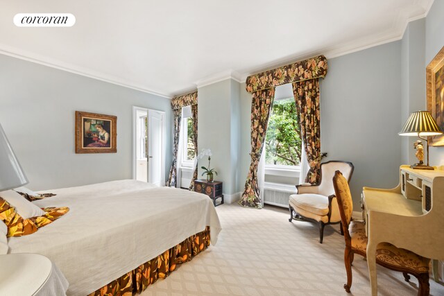 carpeted bedroom featuring crown molding and multiple windows