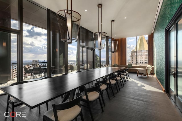 dining area featuring floor to ceiling windows and a healthy amount of sunlight