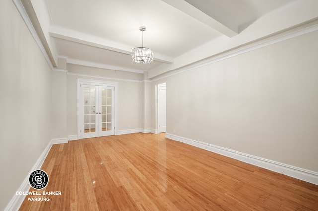 spare room with baseboards, french doors, beam ceiling, light wood finished floors, and an inviting chandelier