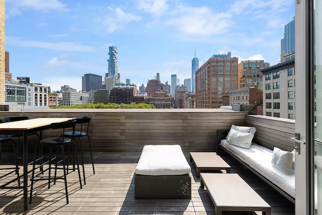 balcony featuring outdoor lounge area and a city view