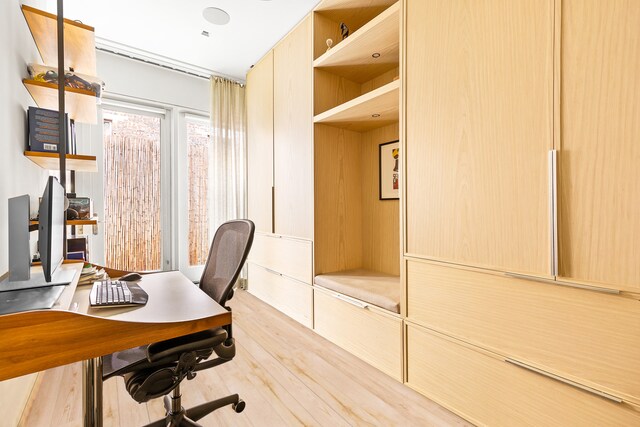 office space with wood finished floors