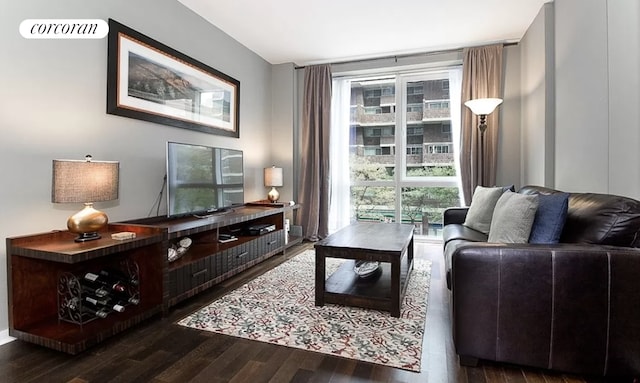 living room featuring visible vents and wood finished floors