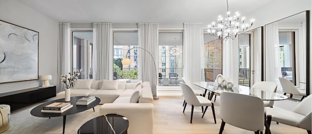 sunroom featuring a chandelier