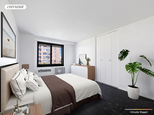 bedroom with a closet, radiator, and visible vents