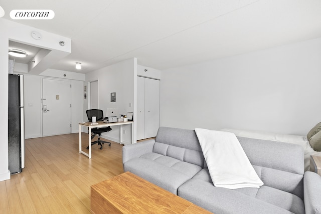 office space with wood finished floors and visible vents