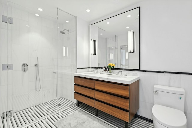 bathroom featuring toilet, tile patterned flooring, walk in shower, and vanity