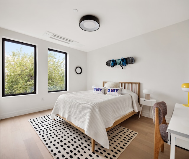 bedroom featuring light hardwood / wood-style floors