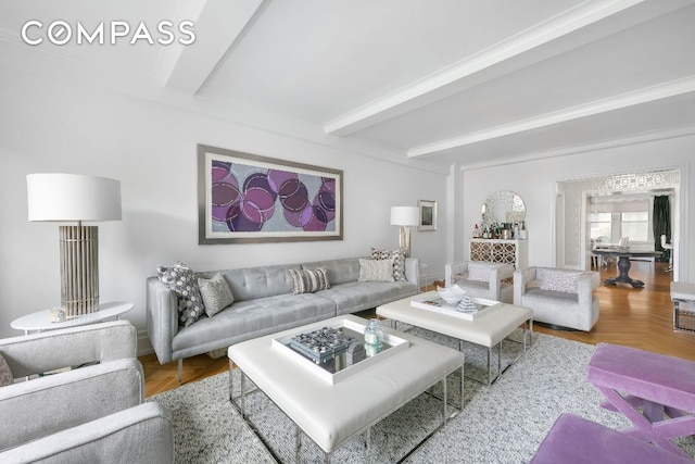 living room featuring hardwood / wood-style floors and beamed ceiling