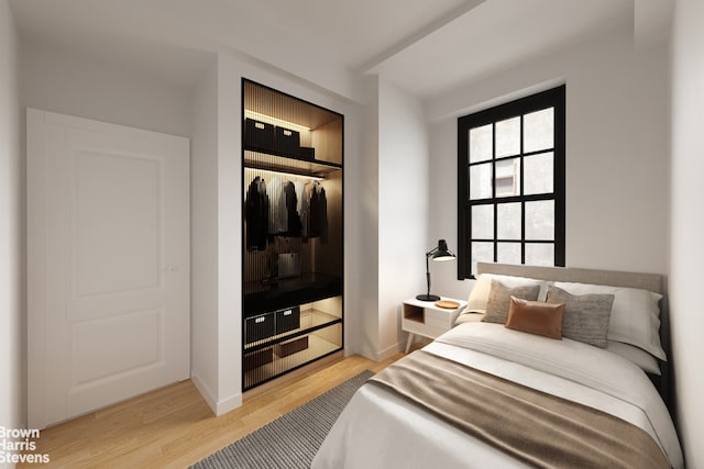 35 W 9th St Unit 1B, New York City, NY 10011 - bedroom with wood finished floors, a closet, and baseboards