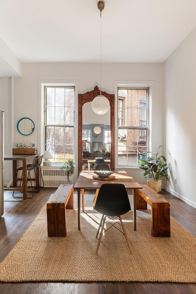 office area featuring radiator heating unit and baseboards