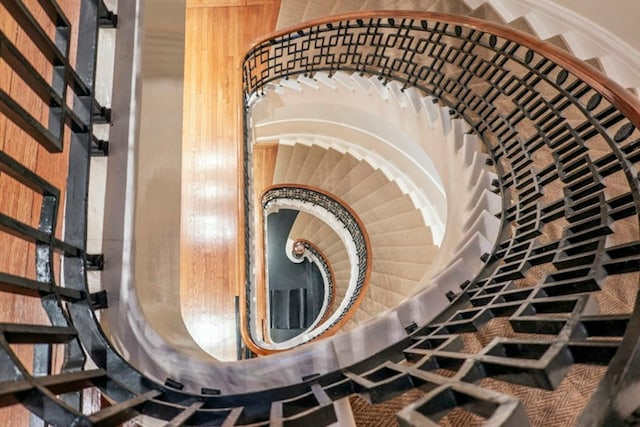 stairs with wood walls