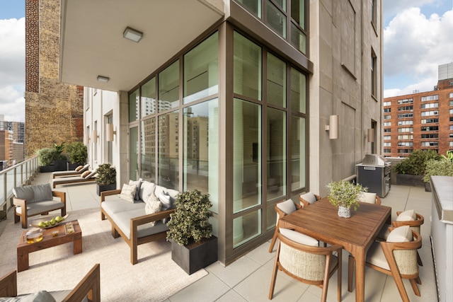 balcony featuring a grill and an outdoor living space