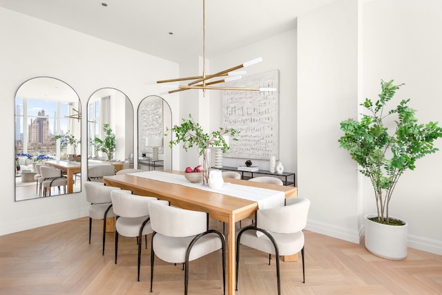 dining space featuring light parquet floors