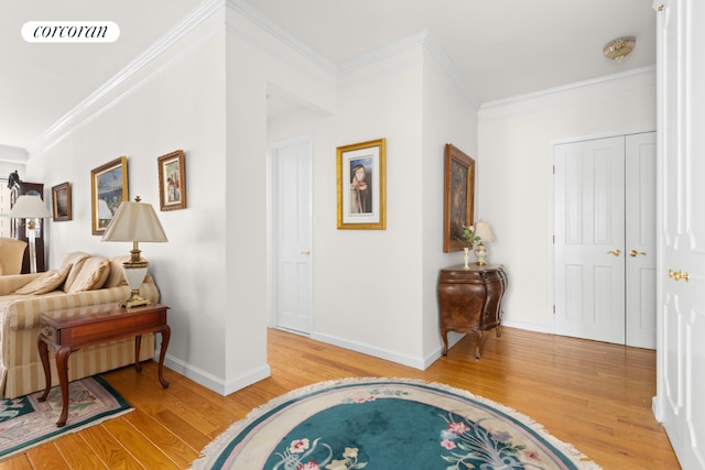 foyer entrance featuring hardwood / wood-style flooring and ornamental molding