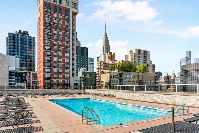 300 E 40th St Unit 31S, New York City, NY 10016 - community pool featuring a skyline view