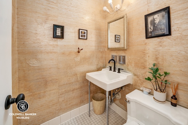 bathroom featuring tile patterned flooring and toilet